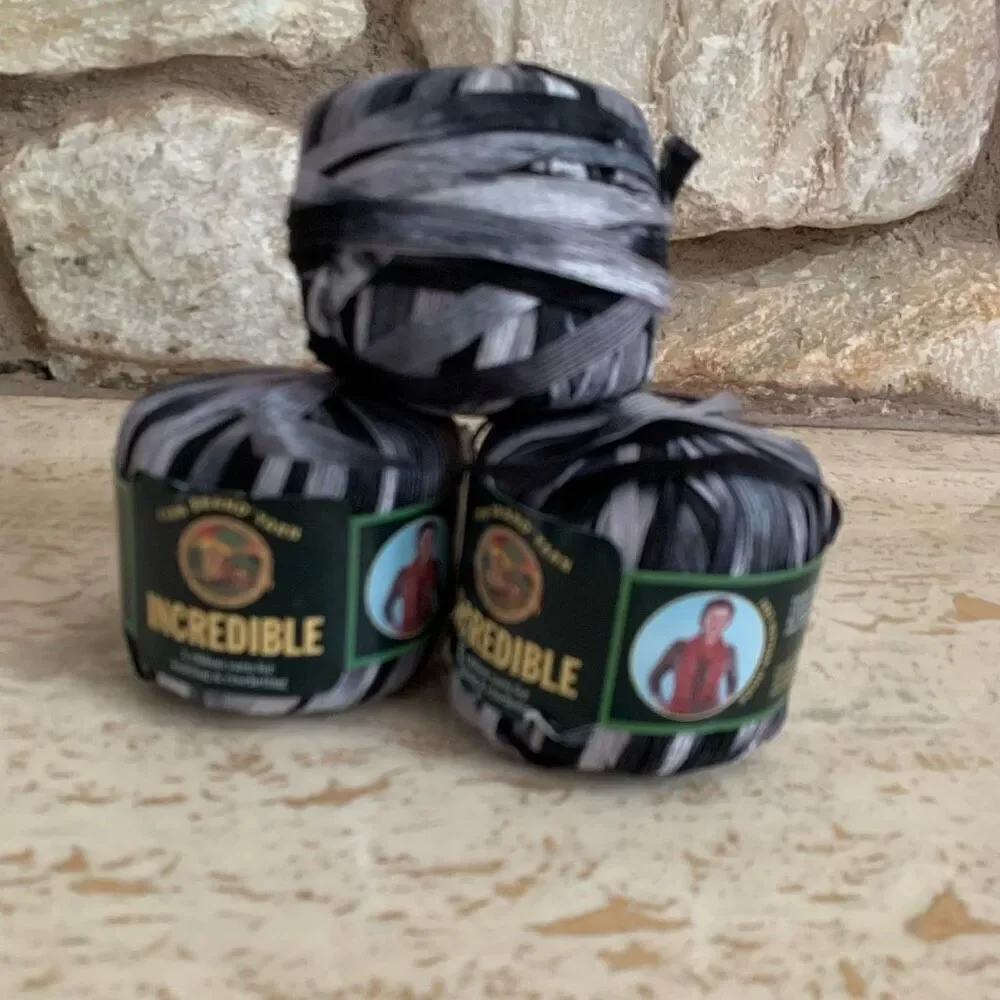 Lion brand incredible ribbon yarn in accent on black